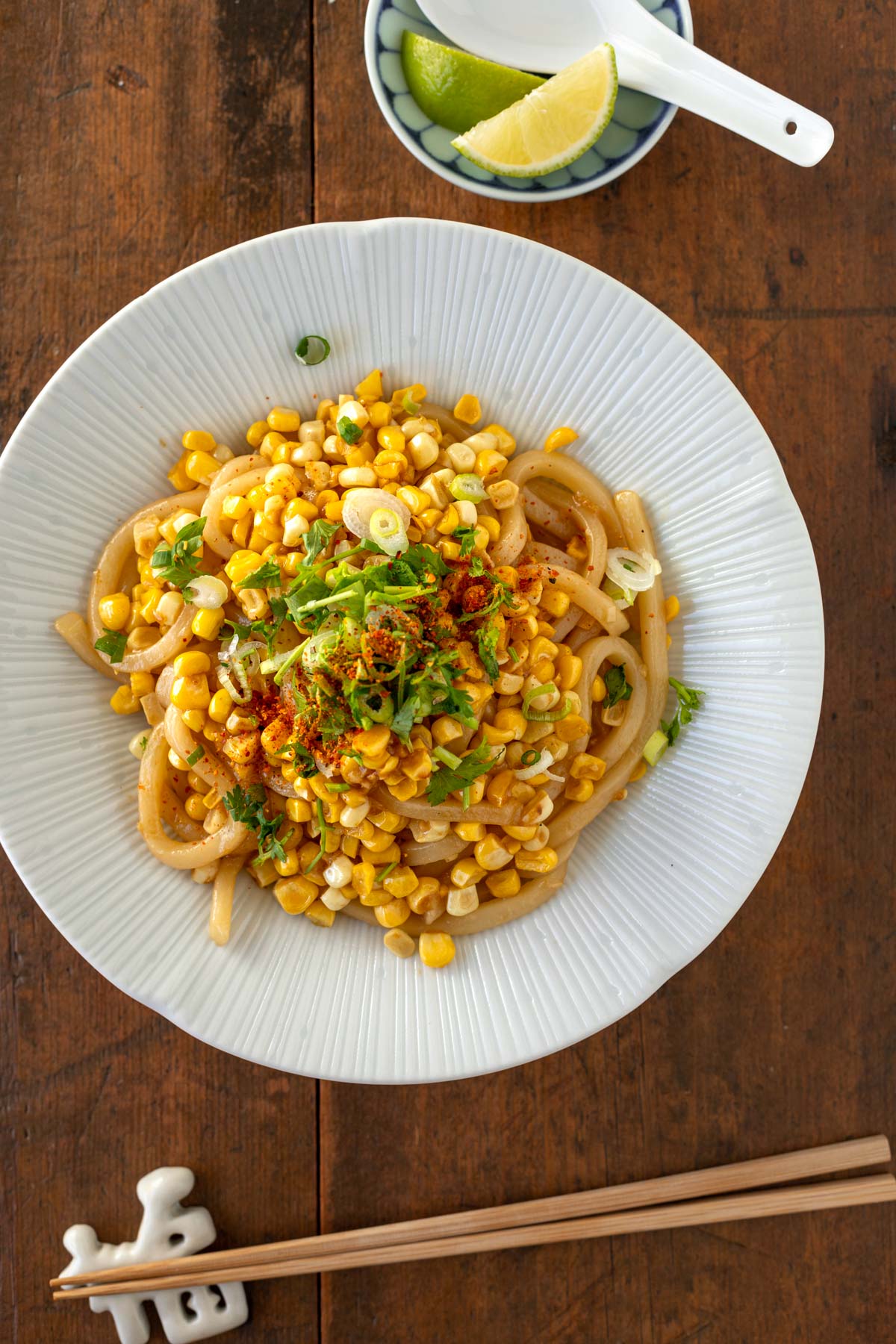 Sweet Corn Udon with Garlic Soy Butter with lime wedge and chopsticks