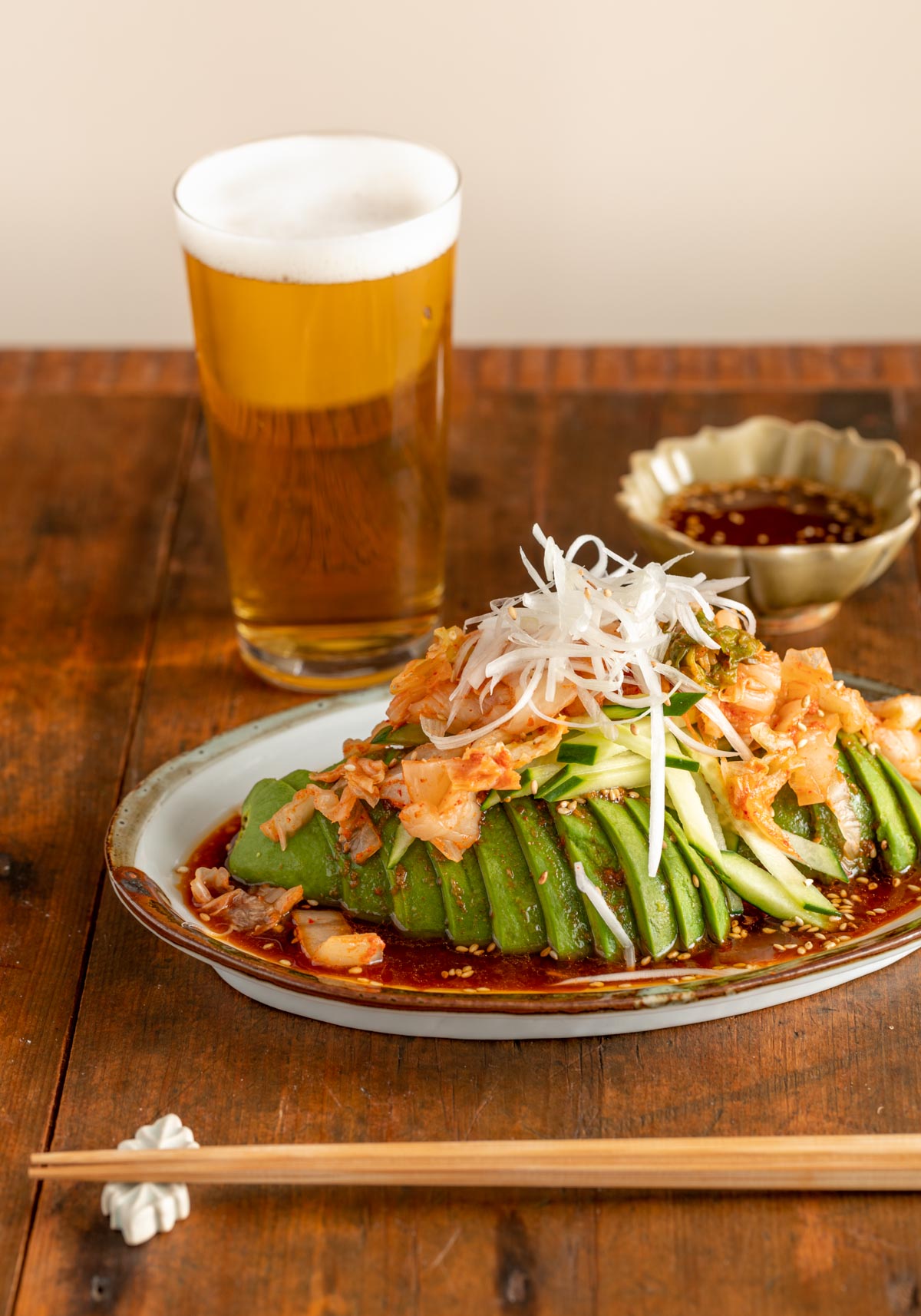 avocado kimchi with gochujang soy sauce with beer with chopstick